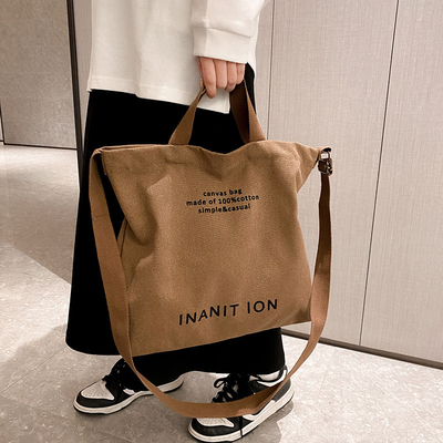 男性と女性のクロスボディバッグ 洗ったキャンバス 厚いハンドバッグ 大容量 トレンド URBAN ART 学生バッグ