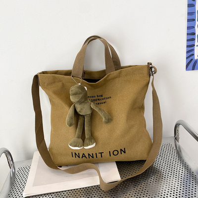 男性と女性のクロスボディバッグ 洗ったキャンバス 厚いハンドバッグ 大容量 トレンド URBAN ART 学生バッグ