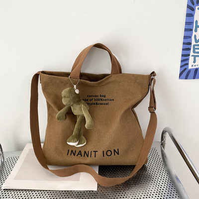 男性と女性のクロスボディバッグ 洗ったキャンバス 厚いハンドバッグ 大容量 トレンド URBAN ART 学生バッグ